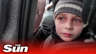 'We left our Dad in Kyiv' - young boy in tears as he escapes Russian advance in Ukraine