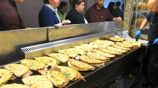 Italy Street Food. Flat Bread Filled with Salami, Ham, Mortadella. 'Spianata Bolognese'