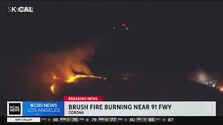 Brush fire burning near 91 Freeway in Corona