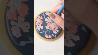 Decorated cookies with wet on wet royal icing flowers