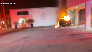 Car crashes into shop, Good Samaritan saves driver before car erupts in flames