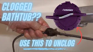 Unclogging bathtub drain using a Husky Auger