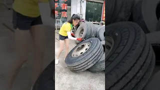 Amazing woman changing truck tires