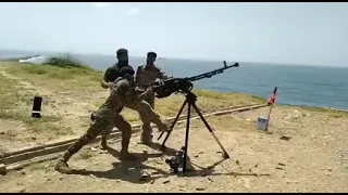 12.7 mm anti aircraft gun firing by marines