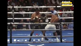 Devin Haney wobbles back to his corner after he got saved by the bell