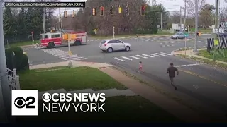 Caught on video: Little girl rescued from traffic