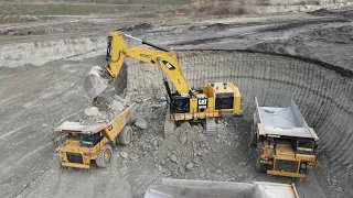 Huge Caterpillar 6015B Excavator Loading Caterpillar Dumpers - Sotiriadis Mining Works