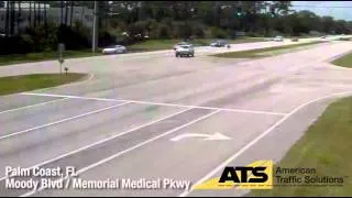 Car hits red light camera pole in Palm Coast