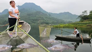 The girl made a giant racket on the boat to scoop fish.