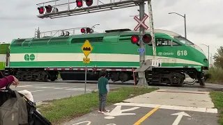 A GO train at maple go and Rutherford go.