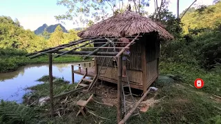 Girl builds a kitchen out of bamboo.camping survive