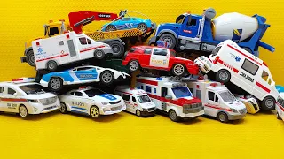 Collection of beautiful toy cars: ambulance, transforming police car, fire truck, crane truck
