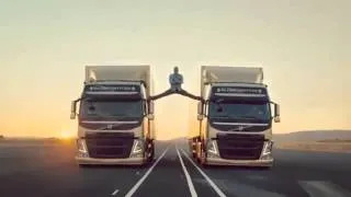 Jean Claude Van Damme Does a Split between Two Moving Trucks