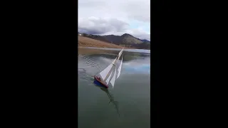 Sailing a wooden pond yacht model of Britannia.