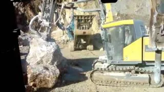 Driling a blasting holl into very hard rock.