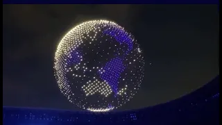 1800 drones starting their formation to form a shiny globe as part of the Tokyo 2020 Olympics.