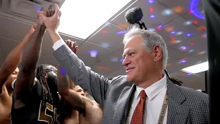 Dennis Allen, Gayle Benson, & Mickey Loomis inside the Saints locker room after Loomis' 200th win