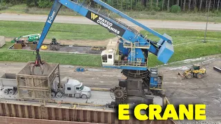 Giant Electric crane unloading barges of scrap iron