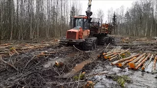 Valmet 840.2 forwarder logging in wet forest.