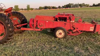 Farmall H baling hay with an IH 430 baler