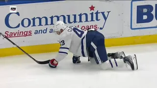 Kyle Clifford crawls to the bench after blocking a shot in the face