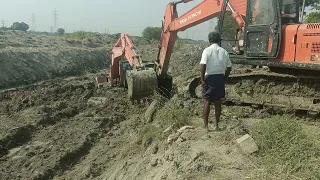 Hitachi stuck in mud