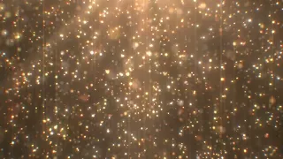 Beautiful Gold Glitter Particle Rain Falling Shimmers Sparkle Light 4K DJ Visuals Loop Background