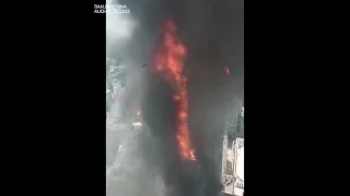 SCENE of huge fire burning on building in Tianjin, China