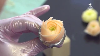 Pink ranunculus of buttercream