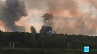 Fire triggers explosions at military arms depot in Siberia