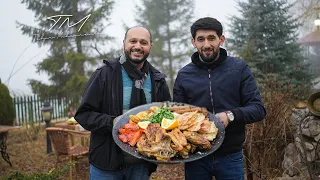 Traditional Azerbaijani cuisine - fried chicken in saje outdoors