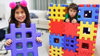 Maria Clara and JP Playing with Toy Blocks