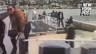 Nearly two dozen suspected migrants seen sprinting off boat as it arrives in luxe California marina