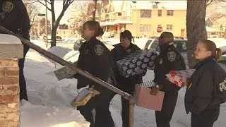 Police officers bring Christmas to needy families