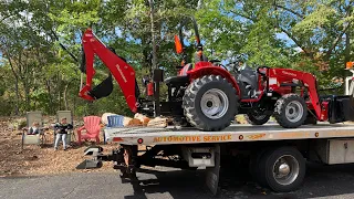 Mahindra 1626 HST tractor with loader and back hoe.