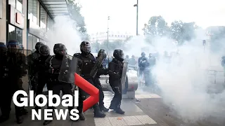 Tear gas fired by police as anti-racism protesters rally in Paris