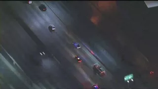 RAW VIDEO: Woman falls out of van during police chase