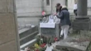 Fans from all around the world gather at the grave of Jim Morrison in Paris on the 50th anniversary