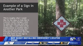 Boy Scout installing emergency locator signs along greenway trails