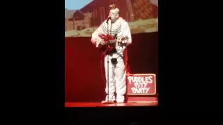 Puddles the Clown singing Put me back in the crowd and playing guitar