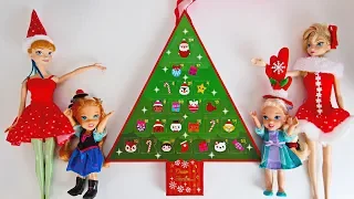 Elsa and Anna toddlers open advent calendars for Christmas