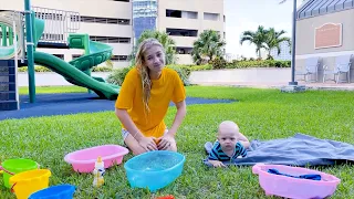 Maggie is swimming with little brother David in the pool!