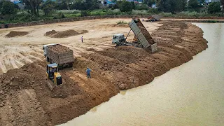 Incredible 2Small Equipment Bulldozer Spreading Land Filling Up & 12 wheel Dump Truck Unloading Dirt