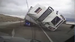 Shocking Moment Semi Truck Topples Over In The Wind And Crushes A Police Car