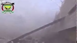 Syrian Army artillery scores a direct hit on FSA rebels.