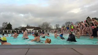 UK swimmers brave cold waters in Christmas Day plunge in Gloucestershire