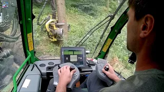 In the cabin of a John Deere harvester