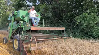 John Deere 40 and 9670 Combines Harvesting Wheat