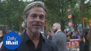 Brad Pitt jokes he and Leonard DiCaprio are 'lovers' at premiere