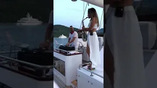 Female sax player boat party in Greece